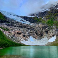 Scenic view of lake and mountains against sky