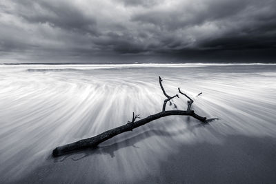 Scenic view of sea against cloudy sky