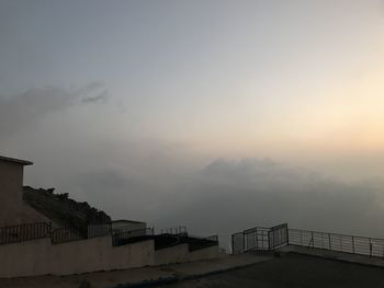 Buildings against sky during sunset