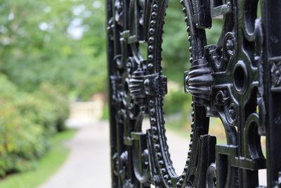 Close-up of garden gate on footpath