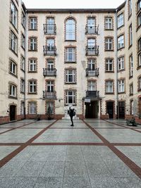 Rear view of man walking on street