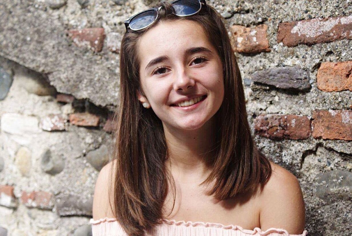 brick wall, portrait, looking at camera, smiling, one person, long hair, outdoors, adult, people, headshot, beautiful woman, happiness, day, beautiful people, young adult, childhood, beauty, cheerful, human body part, one young woman only, one woman only, close-up, only women, child