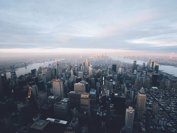 High angle view of modern buildings in city against sky