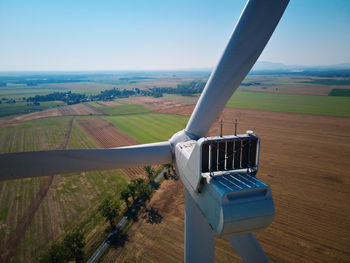 Aerial view of wind turbine in countryside area, wind power plants in agricultural landscape