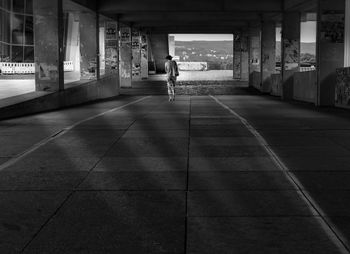 Rear view of man in corridor