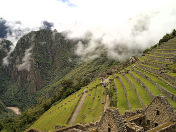 Panoramic view of land and mountains against sky