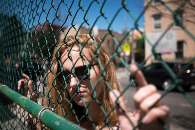 Chainlink fence seen through chainlink fence