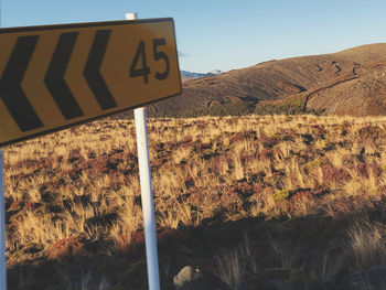 Information sign on road by land