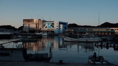 Boats moored at harbor