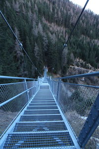 Footbridge against mountains