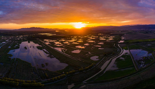 Aerial view of landscape during sunset