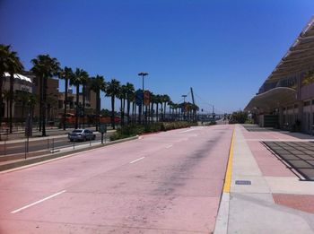 Empty road along buildings