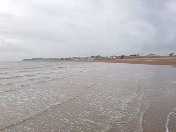 Scenic view of beach against sky