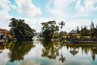 Reflection of trees and buildings in lake