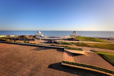 Scenic view of sea against clear blue sky