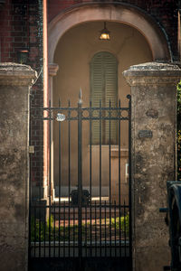 Building seen through metal gate