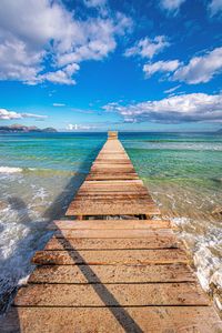 Pier over sea against sky