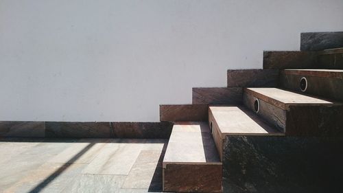 Wooden steps by wall