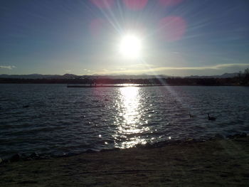 Scenic view of sunset over lake