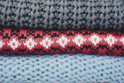 Full frame shot of stacked sweaters