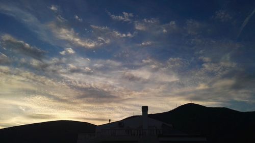 Low angle view of silhouette mountain against sky