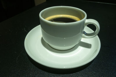 High angle view of coffee cup on table