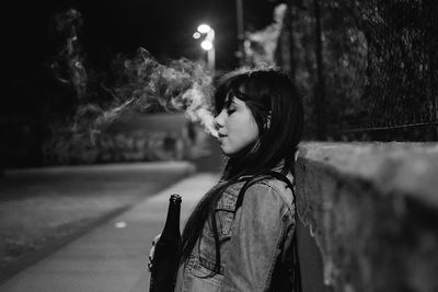 Portrait of young woman looking away