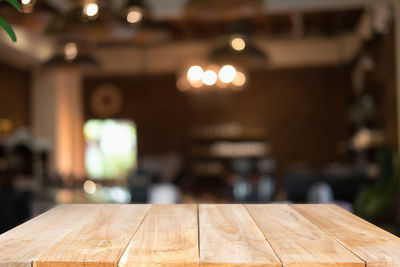 Close-up of illuminated lights on table in restaurant