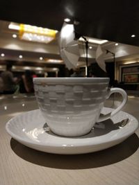Close-up of coffee cup on table in cafe