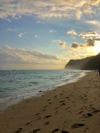 Scenic view of beach against sky during sunset