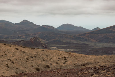 Scenic view of landscape and mountains against sky