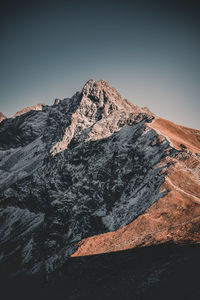 Scenic view of mountain range against clear sky