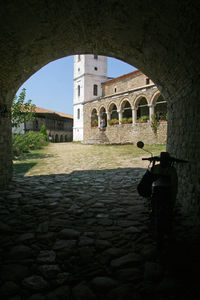 Man seen through archway