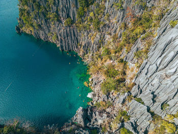 High angle view of rocks on sea