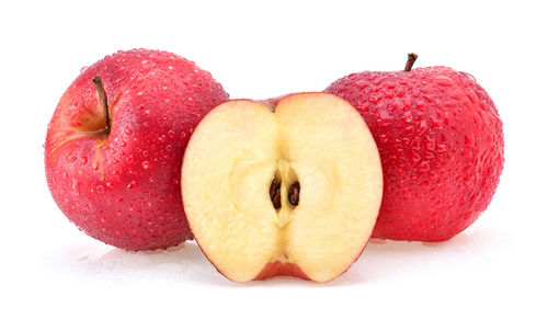 Close-up of apples on apple against white background