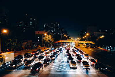 High angle view of traffic on city street at night