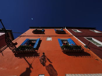 Low angle view of building against blue sky