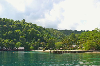 Scenic view of lake against cloudy sky