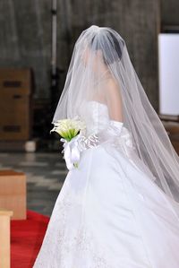 Side view of bride standing in church