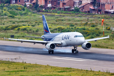 View of airplane at airport runway