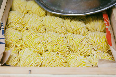 High angle view of fresh ramen noodles in wooden container