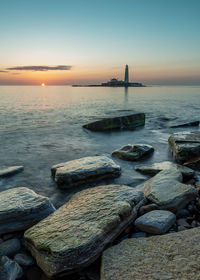 Scenic view of sea against sky during sunset