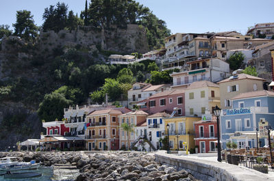 Houses in town against sky