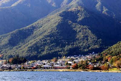 Scenic view of lake and mountains against sky