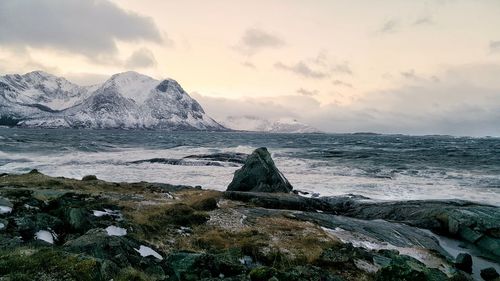 Scenic view of sea against sky during winter