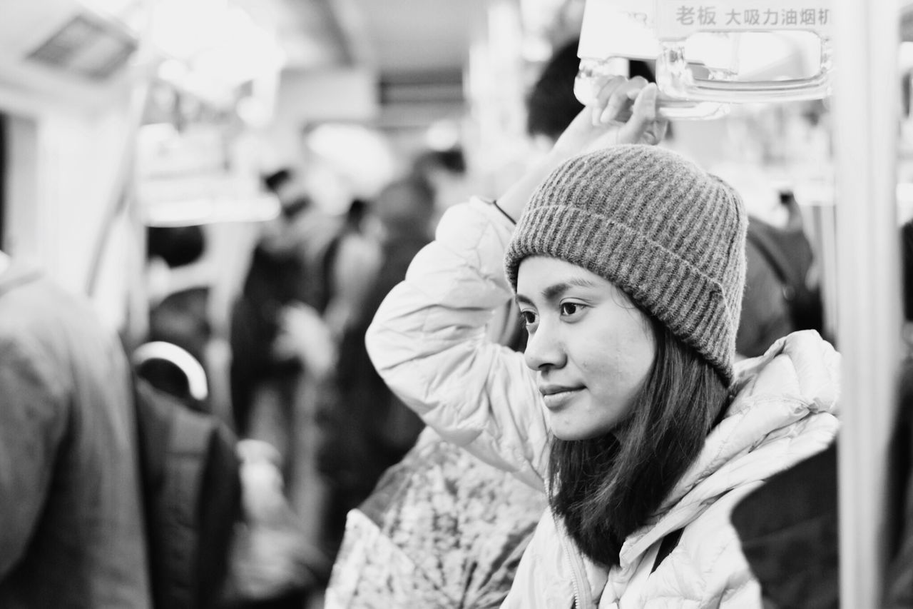 PORTRAIT OF WOMAN WEARING HAT OUTDOORS DURING WINTER