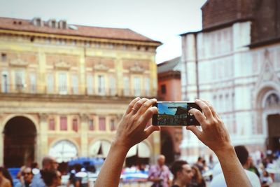 Man photographing with mobile phone