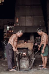 Friends standing on floor at night