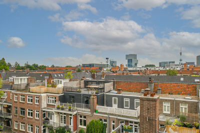 Buildings in city against sky