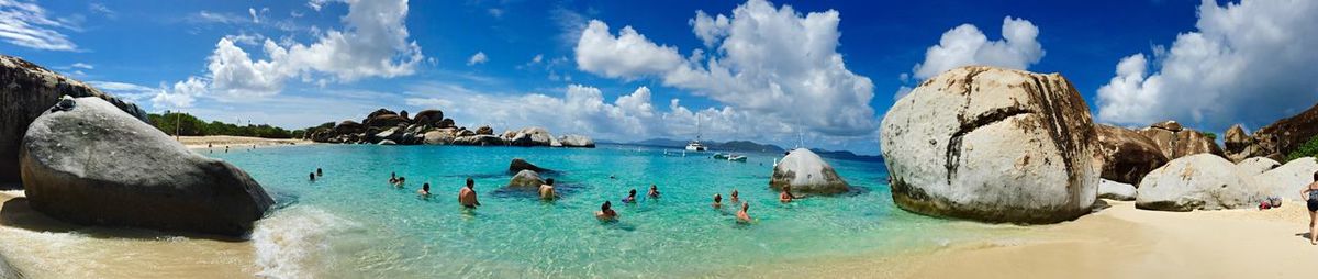 Silhouette of people swimming in sea